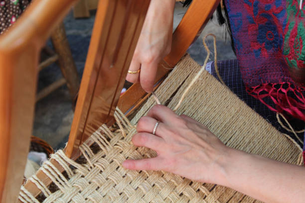 istock Woman making a chair in a traditional way 1255873392