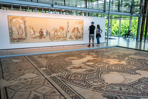 Saint-Romain-en-Gal France, 11 July 2020 : Tourists and ancient Roman mosaic in the museum and archeological Gallo-Roman site of Saint Romain en Gal Vienne France