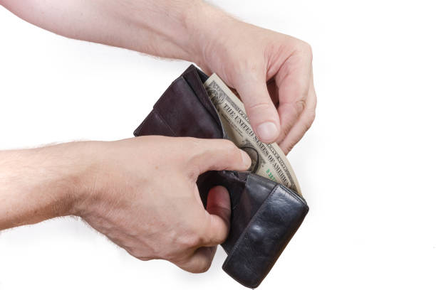 istock Elderly man hands take out small dollar bills from wallet 1255874107