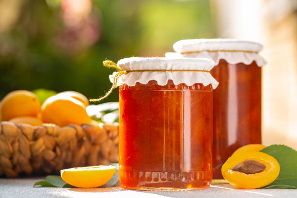 Homemade apricot jam. In the garden.