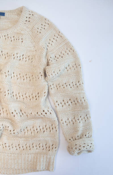istock warm knitted wool sweater sleeve white background 1255877923