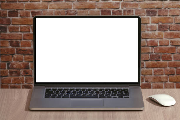 istock Laptop with white blank screen on the office desk 1255879617