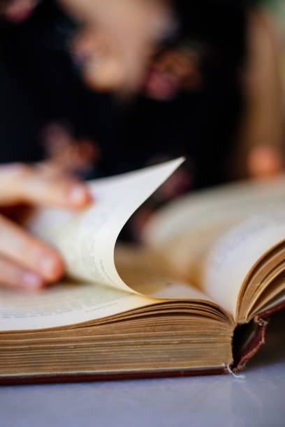 istock Young woman is reading book 1255881123