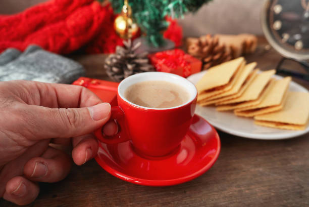 istock Hand hold red coffee cup wirh snack on the table 1255882206
