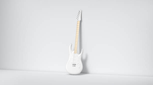 istock Blank white electric guitar mockup, stand near wall 1255882635