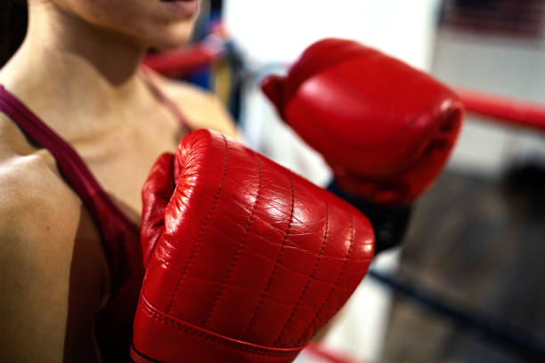 istock Fit female boxer training in a boxing hall 1255882721