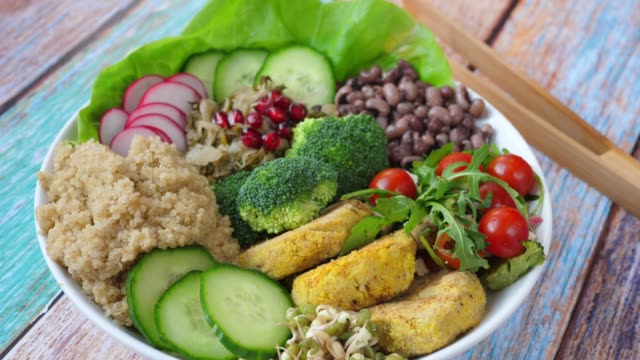 Buddha Bowl With Quinoa, Chickpea Falafel Patties, Red Beans And Salad. Healthy Vegan Food Concept