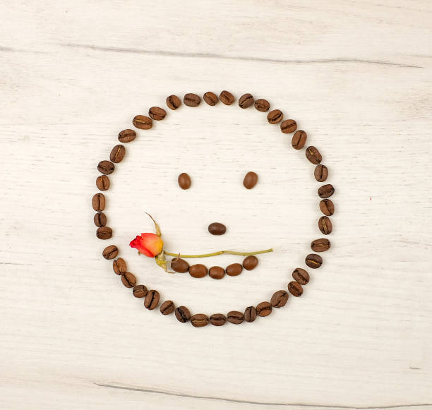 istock Smiley face made of coffee beans. Square image 1255883740