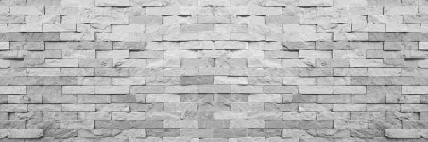 istock Grey aged natural sand stone walling for texture and background 1255884035