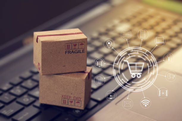istock Shopping online, e-commerce concept: Cardboard boxes with icon customer network connection on keyboard. depicts of transportation that can be done easily using an online internet. 1255884273