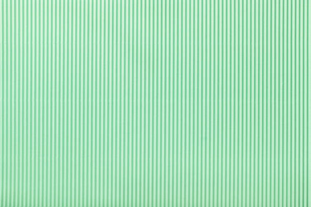 istock Texture of corrugated light green paper, macro. 1255885960