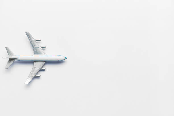 istock Model airplane on a white background with a top view and copy space. 1255886161