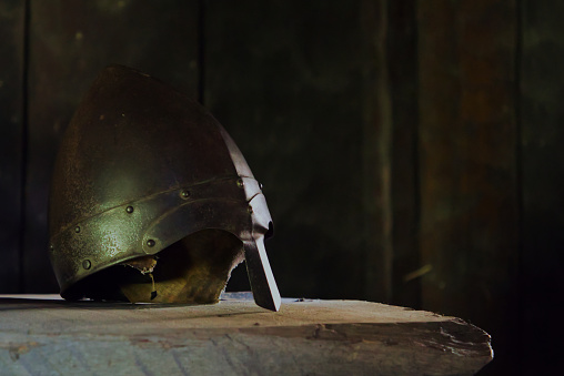 Viking helmet on wooden bench