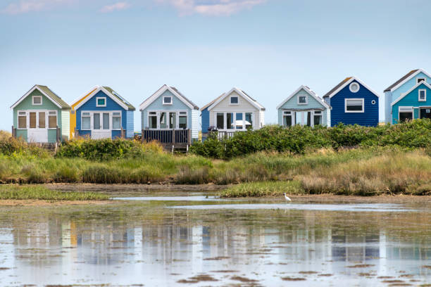 Beach Huts in a row at Hengistbury Head in Bournemouth Beach Huts in a row at Hengistbury Head in Bournemouth hengistbury head photos stock pictures, royalty-free photos & images