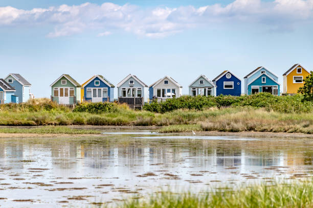 Beach Huts in a row at Hengistbury Head in Bournemouth Beach Huts in a row at Hengistbury Head in Bournemouth hengistbury head photos stock pictures, royalty-free photos & images