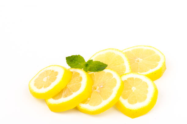 istock Group of lemons with mint leaves, isolated on white background 1255891774