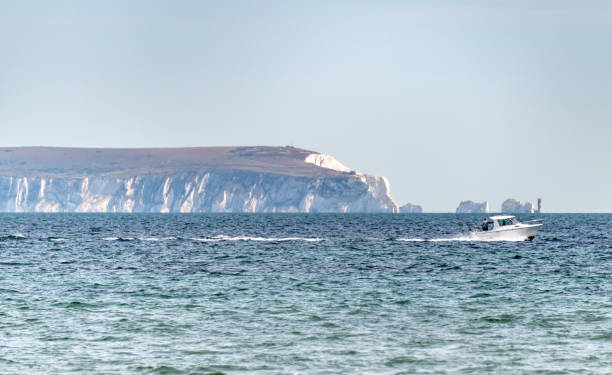 Speed boat by The Needles on the Isle of Wight Bournemouth, UK. Sunday 12 July 2020. Speed boat by The Needles on the Isle of Wight hengistbury head photos stock pictures, royalty-free photos & images
