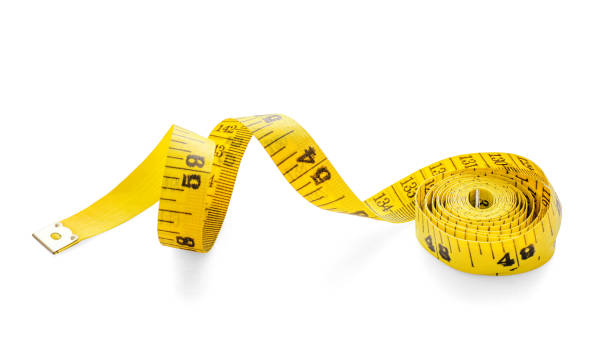 istock Yellow measure tape, diet concept 1255899623