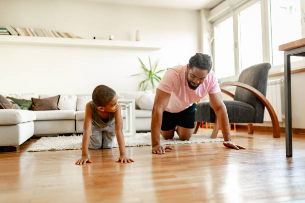 istock Father and son, home exercising 1255900097