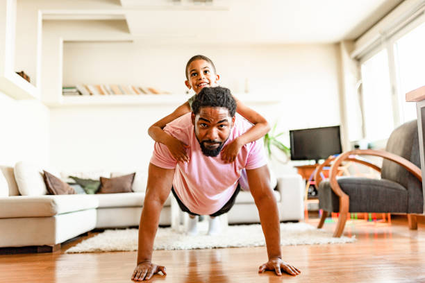 istock Father and son, home exercising 1255900116