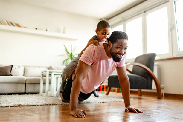 istock Father and son, home exercising 1255900133
