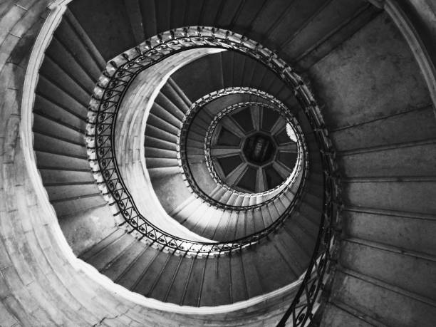 istock High angle view of a spiral staircase. 1255902937