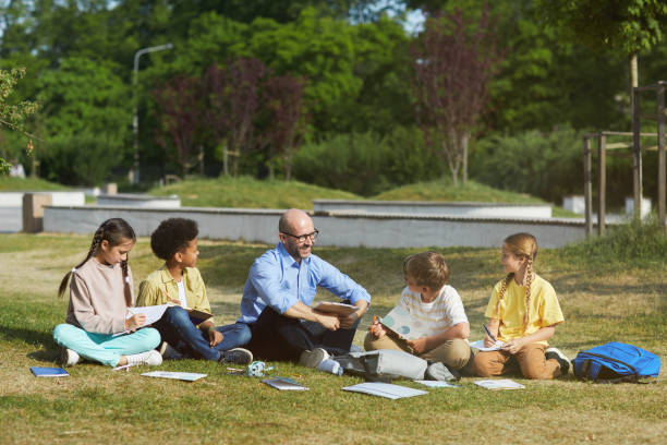istock Kids Enjoying Outdoor School Lesson 1255903531