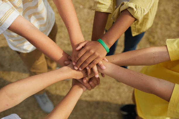istock Kids Holding Hand Outdoors 1255903542