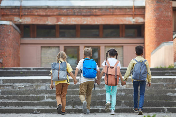 istock Kids Walking to School 1255903572