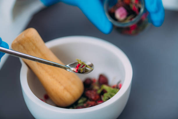 istock Grinding Herbs and Flowers Using Mortar and Pestle 1255904149