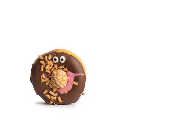 brown chocolate donut with eyes and biscuit - biscuit brown cake unhealthy eating imagens e fotografias de stock