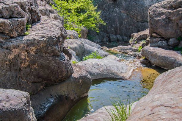 istock Mountain lake, large stone in foreground 1255905548