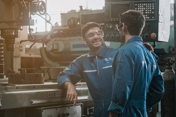 istock engineer men wearing uniform safety in factory. 1255906931
