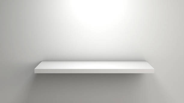 istock 3D rendering of an empty white bookshelf on a white wall for pro 1255908504