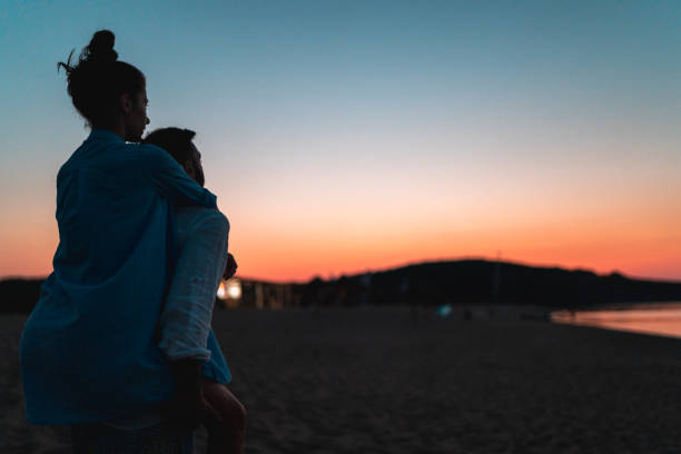istock couple inlove at beach with sunset 1255908549