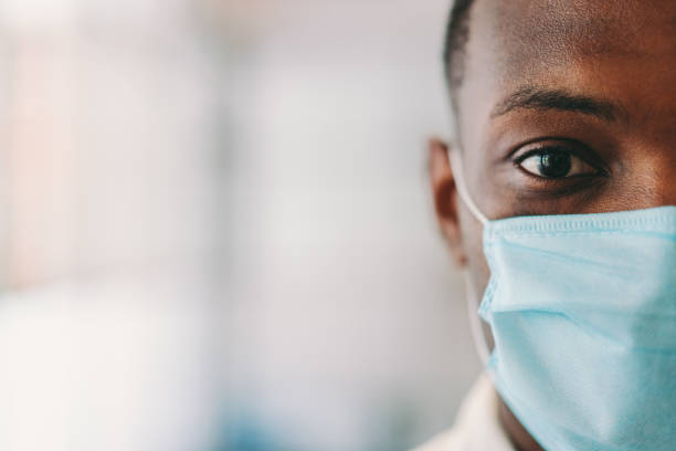 istock Man wearing protective face mask during COVID-19 pandemic 1255908916