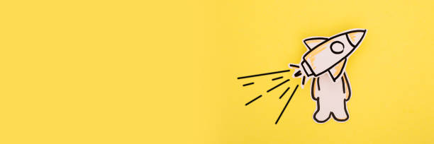 istock Paper astronaut in a rocket the yellow . 1255913850