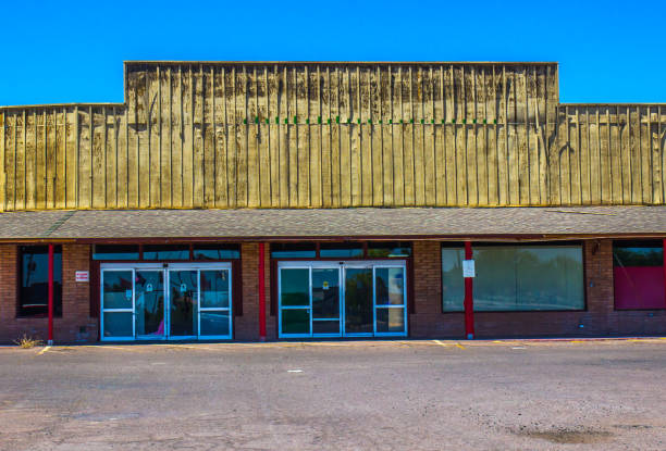 istock Old Abandoned Store Front Building With Blocked Out Windows 1255916345