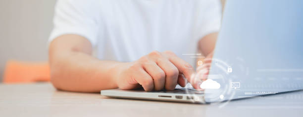 istock close up man hand using laptop to transfer or synch data upload and download from cloud computing storage technology service with virtual interface for futuristic technology system concept 1255917783