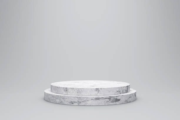 istock White marble product display on white background with modern backdrops studio. Empty pedestal or podium platform. 3D Rendering. 1255917797