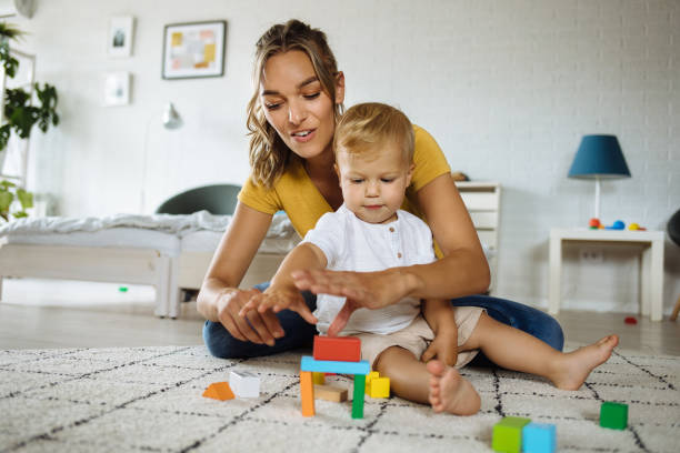 istock Mother and son playing with construction toys 1255919018
