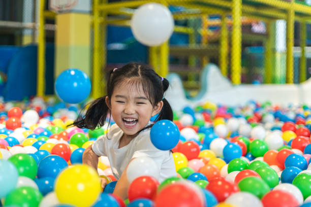 istock Cute girl at the Ball Pool 1255919198
