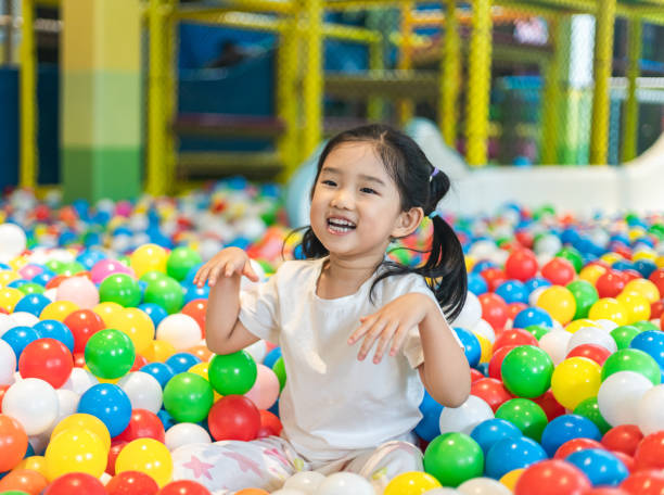 istock Cute girl at the Ball Pool 1255919920