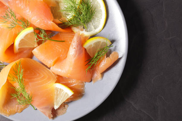 istock smoked salmon sliced and lemon on plate 1255920764
