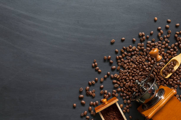 istock coffee bean on black wooden floor background. top view. space for text 1255923032