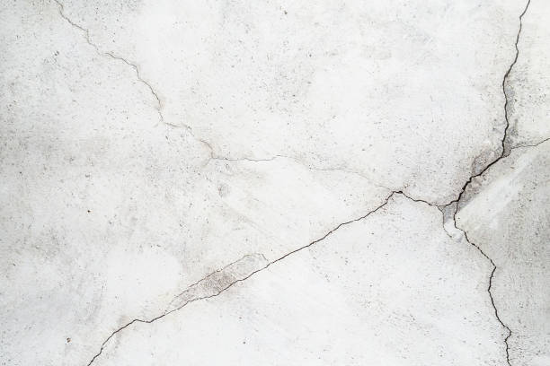 istock Cracked walls illuminated by the light 1255925020