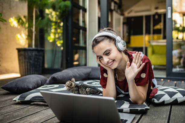 istock Young woman on a video call with friends 1255925045