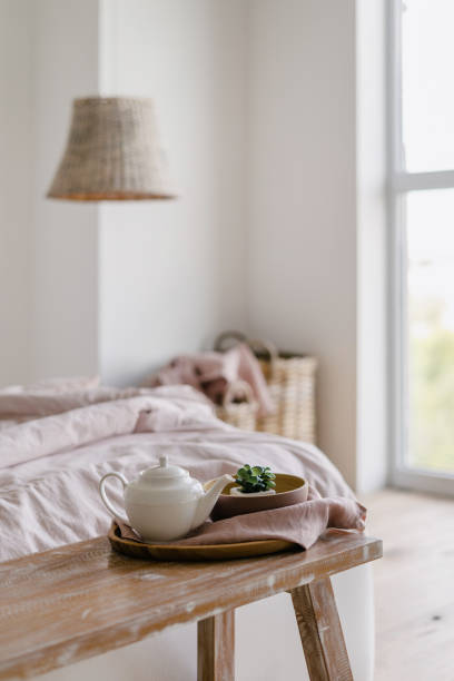 istock Morning in cozy bedroom with comfortable bed 1255926100
