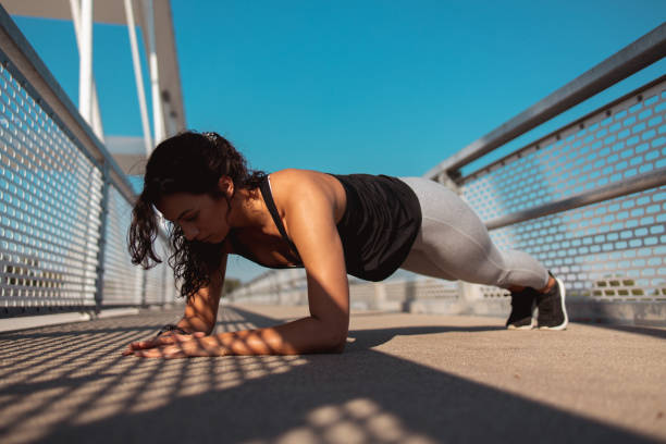 istock Fitness woman on a plank pose 1255928281