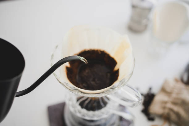 istock Close up poured water drip coffee into the cup with equipment, tool brewing at kitchen home 1255928340
